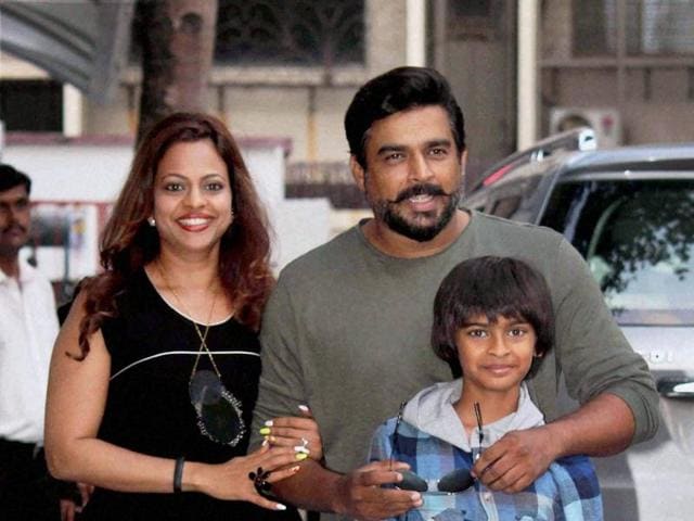 R Madhavan with wife Sarita Birje and son Vedant Madhavan celebrate the fourth birthday celebrations of Shilpa Shetty's son Viaan, in Mumbai on Saturday.  (PTI) 