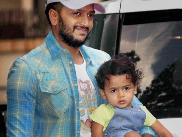 Riteish Deshmukh arrives with his son Riaan to attend Viaan’s birthday celebrations, in Mumbai on May 21.  (PTI) 