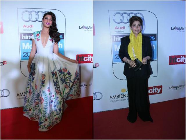 While Jacqueline Fernandez looked gorgeous in a low cut white gown, Dimple Kapadia kept it simple in a black suit that she teamed with a yellow stoll. (Shivam Saxena/HT) While Jacqueline Fernandez looked gorgeous in a low cut white gown, Dimple Kapadia kept it simple in a black suit that she teamed with a yellow stoll. (Shivam Saxena/HT)