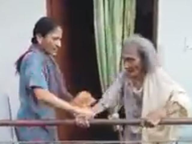 The assault by the woman (left) was recorded by an octogenarian’s neighbour. (Facebook video screengrab) The assault by the woman (left) was recorded by an octogenarian’s neighbour. (Facebook video screengrab)