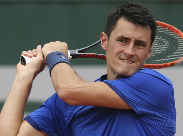 Australia's Bernard Tomic returns in his first round match of the French Open tennis tournament. (AP Photo) Australia's Bernard Tomic returns in his first round match of the French Open tennis tournament. (AP Photo)