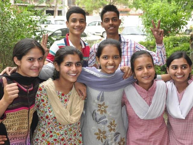 (From left) Toppers Neha Sharma (93.8%), Sunaina Dhiman (93.6%), Pallavi (92%), Neha (91%), Disha (93%); and (behind) Yogesh Kumar (93.6%) and Yash Jain (93.2%), in a jubilant mood. (Sant Arora/HT Photo) (From left) Toppers Neha Sharma (93.8%), Sunaina Dhiman (93.6%), Pallavi (92%), Neha (91%), Disha (93%); and (behind) Yogesh Kumar (93.6%) and Yash Jain (93.2%), in a jubilant mood. (Sant Arora/HT Photo)