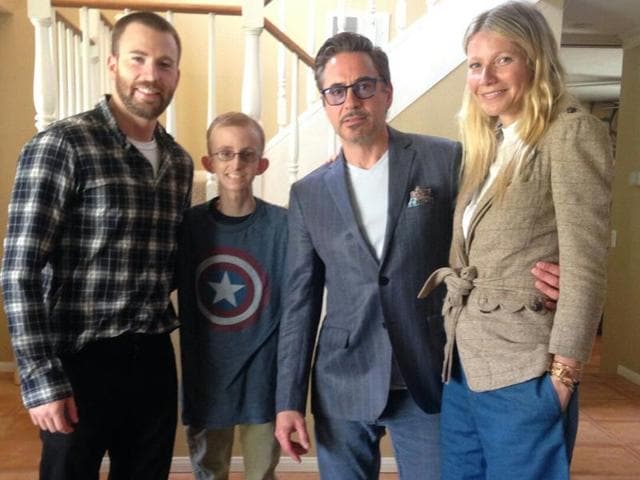 In this Monday photo provided by Amy Wilcox, Ryan Wilcox, poses for a photo with actors from Chris Evans, Robert Downey Jr, and Gwyneth Paltrow during with Wilcox at his home in El Cajon, Calif. The Avengers teamed up to lift the spirits Wilcox, who has been at home for months battling leukemia.(AP)