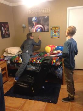 Robert Downey Jr signs Ryan Wilcox’s wall. The Avengers teamed up to lift the spirits of the teenage fan Wilcox, who has been at home for months battling leukemia. (AP) Robert Downey Jr signs Ryan Wilcox’s wall. The Avengers teamed up to lift the spirits of the teenage fan Wilcox, who has been at home for months battling leukemia. (AP)