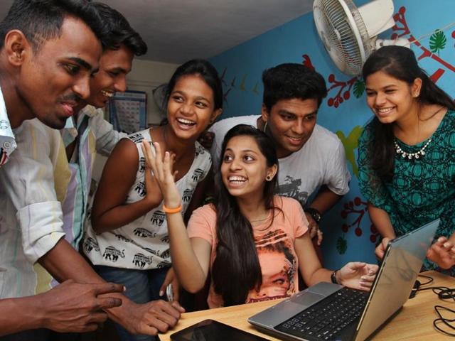 Students celebrate as they check their results online after Maharashtra State Board HSC results were declared in Thane, on Wednesday, May 25, 2016.  (Praful Gangurde) 