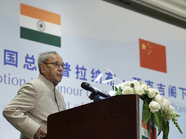 President Pranab Mukherjee is presented a bouquet by a girl on his arrival at the airport in Beijing, China on Wednesday. (PTI) President Pranab Mukherjee is presented a bouquet by a girl on his arrival at the airport in Beijing, China on Wednesday. (PTI)