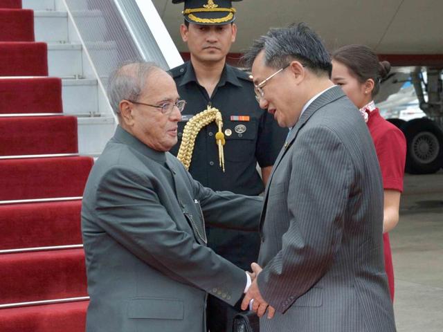 President Pranab Mukherjee is received by China's foreign affairs vice-minister Liu Zhenmin upon his arrival at Guangzhou in China on Tuesday.(PTI) President Pranab Mukherjee is received by China's foreign affairs vice-minister Liu Zhenmin upon his arrival at Guangzhou in China on Tuesday.(PTI)