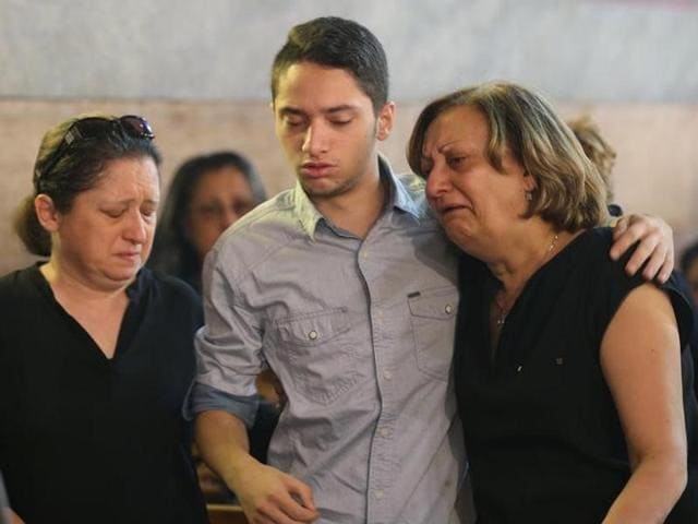 The Imam of al Thawrah Mosque, Samir Abdel Bary, gives condolences to Tarek Abu Laban (centre), who lost four relatives in the EgyptAir plane crash. (AP) The Imam of al Thawrah Mosque, Samir Abdel Bary, gives condolences to Tarek Abu Laban (centre), who lost four relatives in the EgyptAir plane crash. (AP)