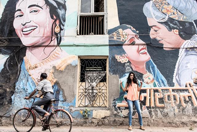 Sarah-Jane Dias poses in front of the Anarkali graffiti on Chapel Road (Photo: Aalok Soni/HT)