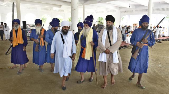 Armed members and followers of the Damdami Taksal at its headquarters at Chowk Mehta near Amritsar on Monday. (Gurpreet Singh/HT Photo)