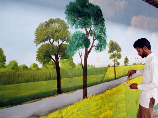 Aiming to make Ludhiana the ‘graffiti capital’ of India, students, artists and NGOs , with the local municipal corporation’s backing, have formed groups to paint pillars, walls and trees in different parts of the city. (JS Grewal/HT Photo)