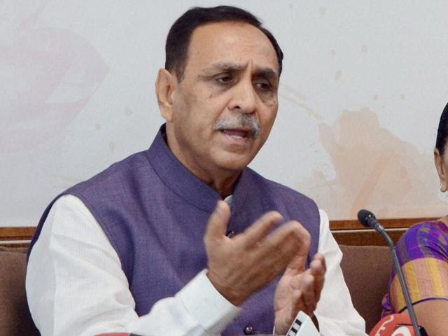 Gujarat BJP chief Vijay Rupani (right) has emerged as the new power centre in the state.(PTI)
