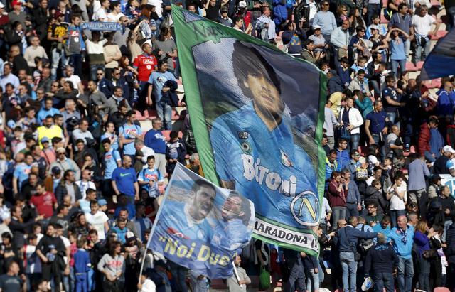 Napoli's supporters wave flags with pictures of former players Diego Armando Maradona and Gonzalo Higuain. (Reuters Photo) Napoli's supporters wave flags with pictures of former players Diego Armando Maradona and Gonzalo Higuain. (Reuters Photo)