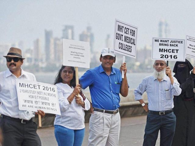 Parents of the students preparing for medical entrance exams, form a human chain to protest against the verdict of Supreme Court's on National Eligibility Entrance Test (NEET) in Mumbai on Tuesday. (PTI) Parents of the students preparing for medical entrance exams, form a human chain to protest against the verdict of Supreme Court's on National Eligibility Entrance Test (NEET) in Mumbai on Tuesday. (PTI)