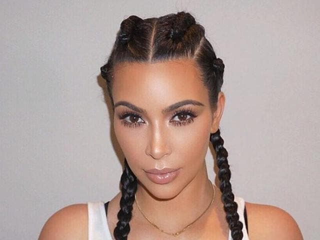 And that would be the real Kim Kardashian rocking the same hairstyle. See what we mean?