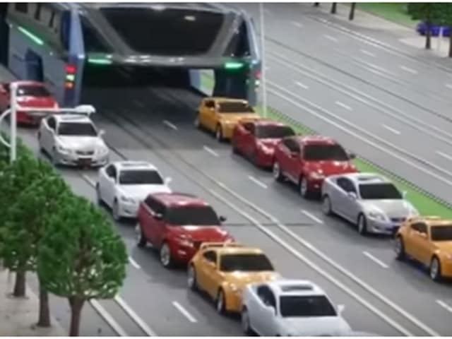 The bus, that can take the place of 40 conventional buses, would run on special tracks built on either side of the lanes, with 2.1 metres of clearance underneath. (Twitter) The bus, that can take the place of 40 conventional buses, would run on special tracks built on either side of the lanes, with 2.1 metres of clearance underneath. (Twitter)