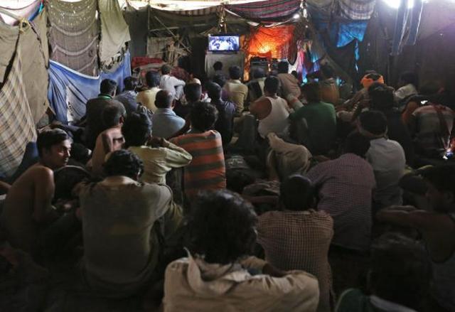 Films that are being screened are advertised in a makeshift cinema located under a bridge in the old quarters of Delhi. (Reuters) Films that are being screened are advertised in a makeshift cinema located under a bridge in the old quarters of Delhi. (Reuters)