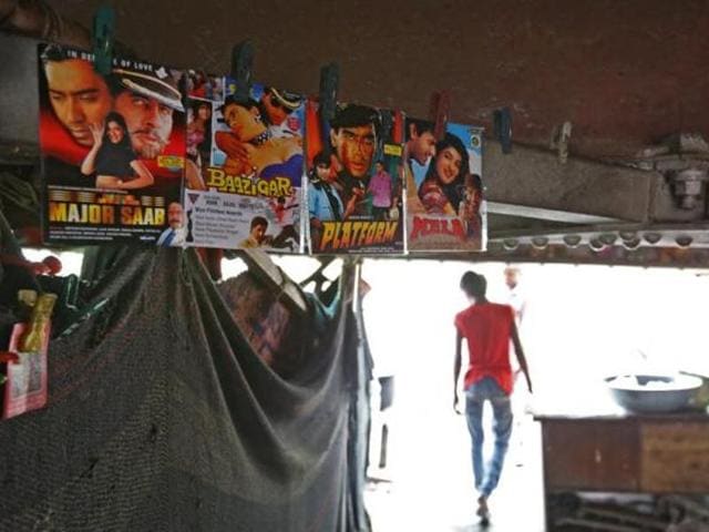 People watch a movie in a makeshift cinema located under a bridge in the old quarters of Delhi, India. (Reuters) People watch a movie in a makeshift cinema located under a bridge in the old quarters of Delhi, India. (Reuters)