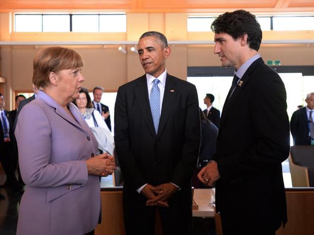German Chancellor Angela Merkel, center, and U.S. President Barack Obama, right, talk chat during the second working session during the 2016 Ise-Shima G7 Summit in Shima. (AP)