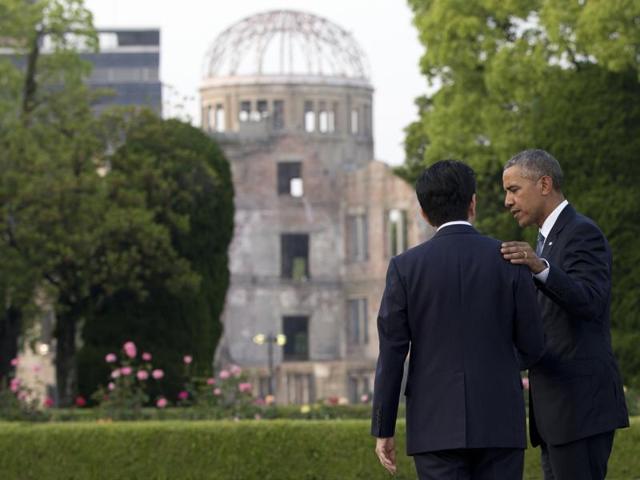 Obama and Abe speak with the Atomic Bomb Dome seen at rear. Obama on Friday became the first sitting US president to visit the site of the world's first atomic bomb attack, bringing global attention both to survivors and to his unfulfilled vision of a world without nuclear weapons. (AP)