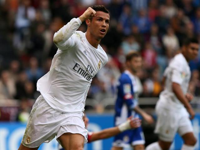 Real Madrid's Portuguese forward Cristiano Ronaldo celebrates after scoring during the Spanish league football match RC Deportivo de la Coruna vs Real Madrid CF at the Municipal de Riazor stadium in La Coruna on May 14, 2016. (AFP) Real Madrid's Portuguese forward Cristiano Ronaldo celebrates after scoring during the Spanish league football match RC Deportivo de la Coruna vs Real Madrid CF at the Municipal de Riazor stadium in La Coruna on May 14, 2016. (AFP)