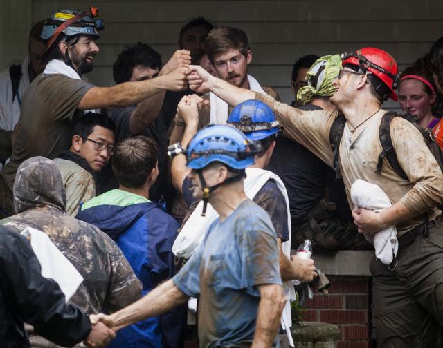 People who were rescued from Hidden River Cave celebrate on Thursday. (AP) People who were rescued from Hidden River Cave celebrate on Thursday. (AP)