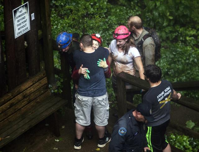 Tour guide Peggy Nims hugs a friend after she made it out of Hidden River Cave on Thursday, May 26, 2106, after 18 people on a cave tour were trapped due to flash flood waters in Horse Cave, Kentucky. (AP) Tour guide Peggy Nims hugs a friend after she made it out of Hidden River Cave on Thursday, May 26, 2106, after 18 people on a cave tour were trapped due to flash flood waters in Horse Cave, Kentucky. (AP)