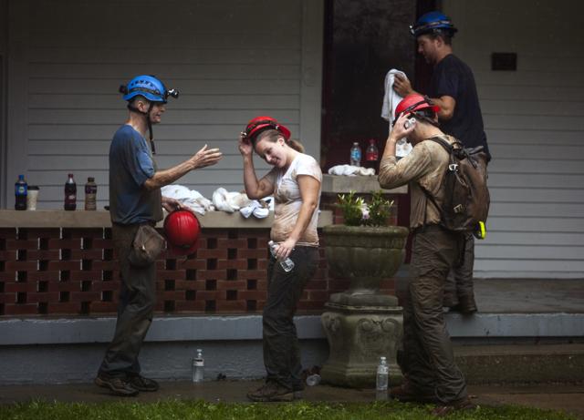 Becca Dozier, middle, takes off her helmet after having been rescued from Hidden River Cave on Thursday. (AP) Becca Dozier, middle, takes off her helmet after having been rescued from Hidden River Cave on Thursday. (AP)