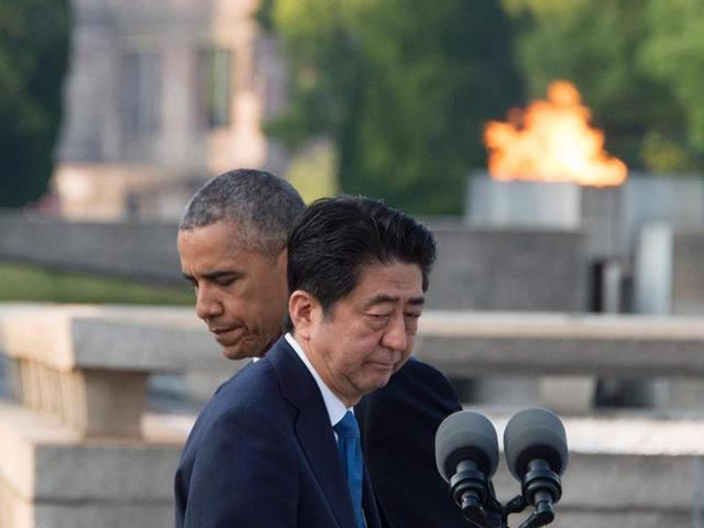 Abe (front R) prepares to speak following Obama made remarks after the two placed wreaths during a visit to the Hiroshima Peace Memorial Park in Hiroshima. (AFP)