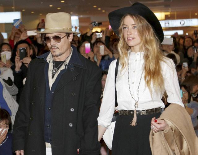 In this file photo, US actor Johnny Depp and Amber Heard arrive at Haneda international airport in Tokyo.The pair were married in February 2015 and have no children together. (AP) In this file photo, US actor Johnny Depp and Amber Heard arrive at Haneda international airport in Tokyo.The pair were married in February 2015 and have no children together. (AP)