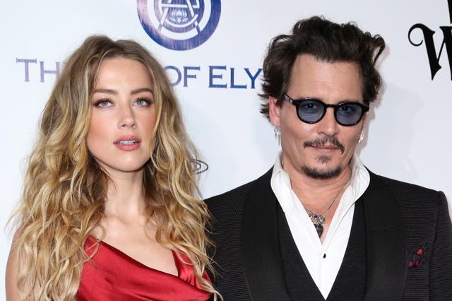 In this file photo, Amber Heard and Johnny Depp arrive at The Art of Elysium's Ninth annual Heaven Gala at 3LABS, in Culver City, Calif. Heard was in Los Angeles Superior Court court on Friday and provided a sworn declaration that her husband Johnny Depp threw her cellphone at her during a fight Saturday, striking her cheek and eye. (Rich Fury/Invision/AP) In this file photo, Amber Heard and Johnny Depp arrive at The Art of Elysium's Ninth annual Heaven Gala at 3LABS, in Culver City, Calif. Heard was in Los Angeles Superior Court court on Friday and provided a sworn declaration that her husband Johnny Depp threw her cellphone at her during a fight Saturday, striking her cheek and eye. (Rich Fury/Invision/AP)