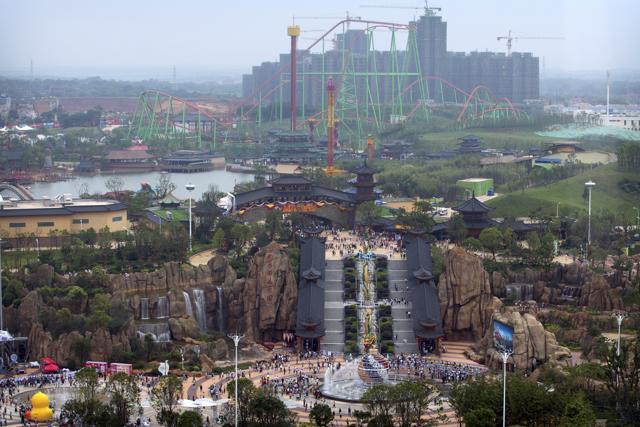 China's largest private property developer, the Wanda Group, opened an entertainment complex on Saturday to position itself as a distinctly homegrown rival to Disney as the American entertainment giant opens its $5.5 billion Shanghai theme park next month. (AP)