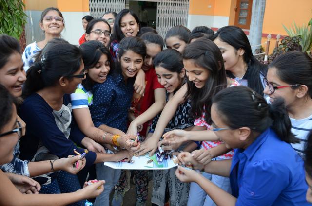 students treating themselves to chocolates after achieving full CGPA in the class 10 board examination at Bhopal’s St. Joseph's Convent. (HT Photo )