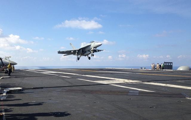 This file photo shows an FA-18 jet fighter landing on the USS John C Stennis aircraft carrier in the South China Sea while US Defense Secretary Ash Carter visited the aircraft carrier during a trip to the region.(AP)