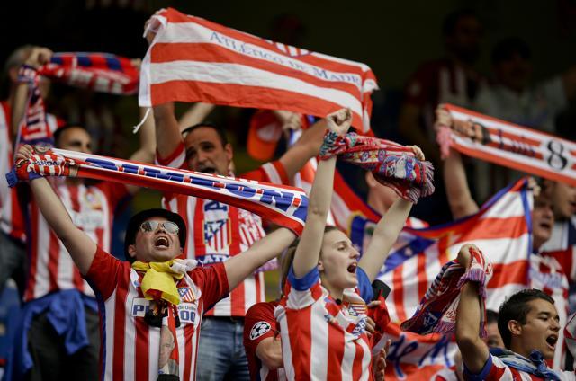 Atletico Madrid fans chant prior to the Champions League final football match between Real Madrid and Atletico Madrid at the San Siro stadium in Milan, Italy. (AP Photo)