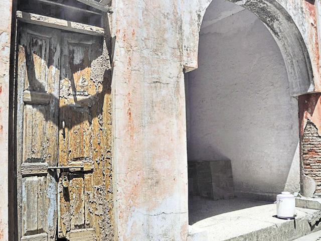 Seepage, trees taking root in walls and termite-infested doors at the 159-year-old heritage building in Sector 12-A, Panchkula.(Sant Arora/HT Photo) Seepage, trees taking root in walls and termite-infested doors at the 159-year-old heritage building in Sector 12-A, Panchkula.(Sant Arora/HT Photo)