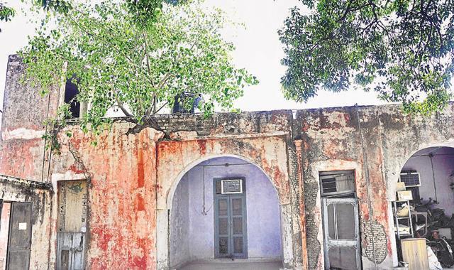 Seepage, trees taking root in walls and termite-infested doors at the 159-year-old heritage building in Sector 12-A, Panchkula. (Sant Arora/HT Photo) Seepage, trees taking root in walls and termite-infested doors at the 159-year-old heritage building in Sector 12-A, Panchkula. (Sant Arora/HT Photo)