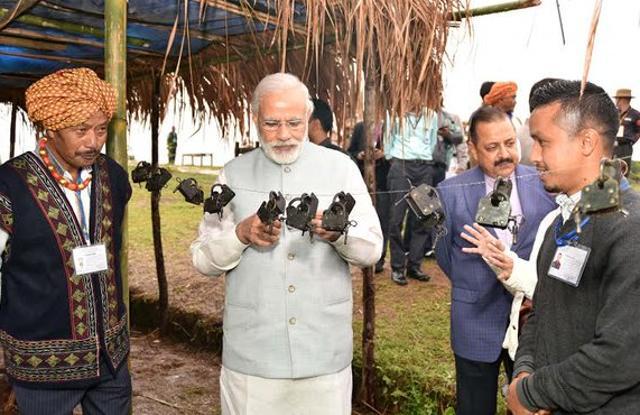 Prime Minister Modi at a heritage village in Meghalaya on May 28, 2016, during his visit to the state. (Picture courtesy: @PIB_India) Prime Minister Modi at a heritage village in Meghalaya on May 28, 2016, during his visit to the state. (Picture courtesy: @PIB_India)