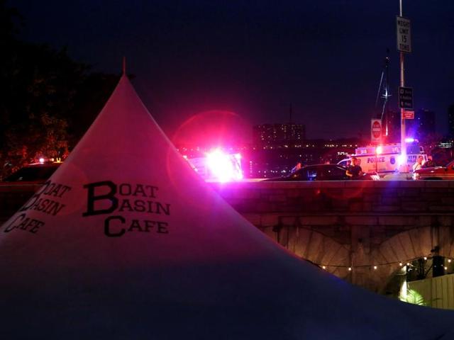 Emergency personnel gathers near the 79th St. Boat Basin of the Hudson River, into which a vintage World War II plane crashed near New Jersey's Edgewater Marina. (AFP Photo) Emergency personnel gathers near the 79th St. Boat Basin of the Hudson River, into which a vintage World War II plane crashed near New Jersey's Edgewater Marina. (AFP Photo)