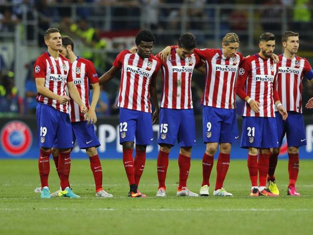 Atletico Madrid players stand together during the penalty shoot out. (Reuters Photo) Atletico Madrid players stand together during the penalty shoot out. (Reuters Photo)