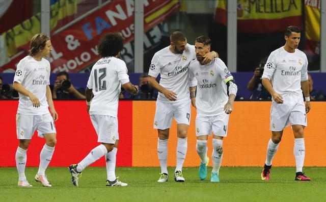 Sergio Ramos celebrates with teammates after scoring the opening goal for Real Madrid in the Uefa Champions League final against Atletico Madrid. (Reuters Photo) Sergio Ramos celebrates with teammates after scoring the opening goal for Real Madrid in the Uefa Champions League final against Atletico Madrid. (Reuters Photo)