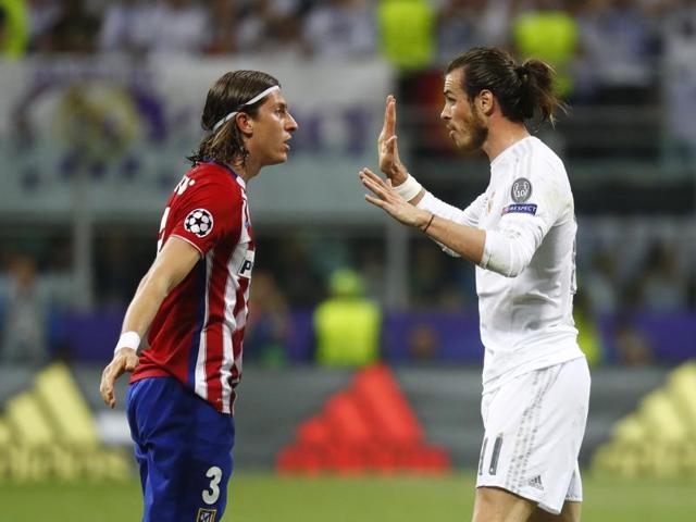 Atletico Madrid's Filipe Luis clashes with Real Madrid's Gareth Bale. (Reuters Photo)
