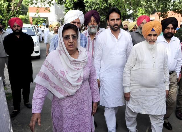 Senior Congress leader Rajinder Kaur Bhattal and AAP senior leader Sucha Singh Chottepur coming out after meeting the family members of Harkirat Singh in Chandigarh on Sunday. (Keshav Singh/HT Photo)