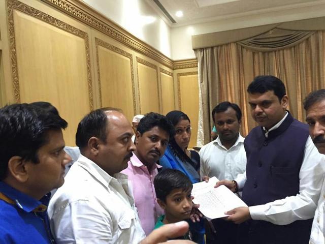 File photo of Dilip Patidar's family members, including wife Padma and son Himanshu, handing over a memorandum to Maharashtra CM Devendra Fadnavis in Mumbai recently. File photo of Dilip Patidar's family members, including wife Padma and son Himanshu, handing over a memorandum to Maharashtra CM Devendra Fadnavis in Mumbai recently.
