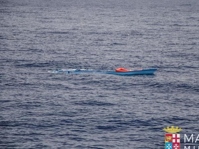 A partially submerged boat which was used by a group of migrants to reach the Italian coasts. A UN agency said on Sunday that more than 700 migrants were feared dead in three shipwrecks in the Mediterranean in the last few days. (AP) A partially submerged boat which was used by a group of migrants to reach the Italian coasts. A UN agency said on Sunday that more than 700 migrants were feared dead in three shipwrecks in the Mediterranean in the last few days. (AP)