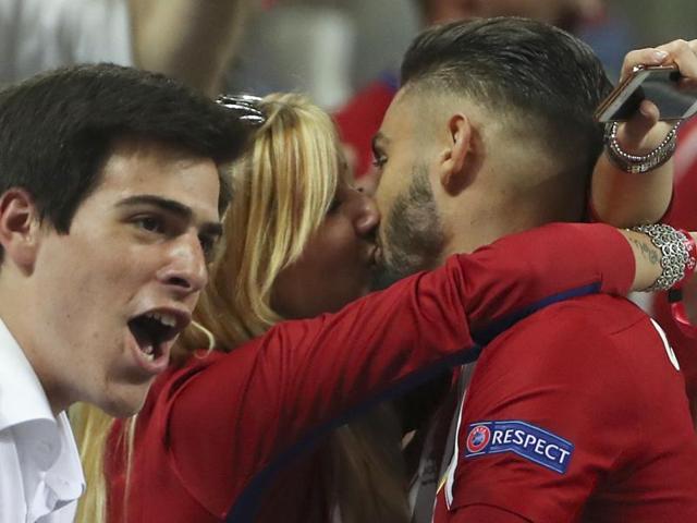 Atletico's Yannick Carrasco gets a kiss as he celebrates after scoring during the Champions League final football match between Real Madrid and Atletico Madrid at the San Siro stadium in Milan, Italy. (AP Photo) Atletico's Yannick Carrasco gets a kiss as he celebrates after scoring during the Champions League final football match between Real Madrid and Atletico Madrid at the San Siro stadium in Milan, Italy. (AP Photo)