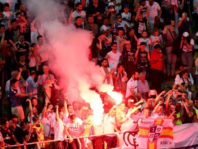 Real Madrid supporters celebrate after Cristiano Ronaldo scored the winning penalty in a shoot out during the Champions League final football match between Real Madrid and Atletico Madrid at the San Siro stadium in Milan, Italy. (AP Photo) Real Madrid supporters celebrate after Cristiano Ronaldo scored the winning penalty in a shoot out during the Champions League final football match between Real Madrid and Atletico Madrid at the San Siro stadium in Milan, Italy. (AP Photo)
