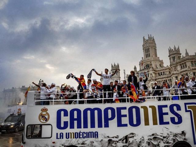 Real Madrid players arrive at Cibeles square after winning the Champions League final football match between Real Madrid and Atletico Madrid, during a celebration parade in Madrid. (AP Photo)