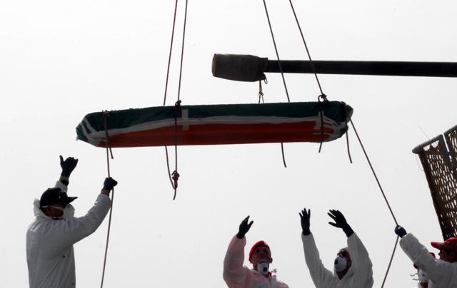 One of the 45 bodies of migrants that were recovered by the Italian military ship Vega during its search and rescue mission in the Mediterranean sea, is being disembarked at the harbor of Reggio Calabria, Southern Italy, Sunday, May 29, 2016. (AP) One of the 45 bodies of migrants that were recovered by the Italian military ship Vega during its search and rescue mission in the Mediterranean sea, is being disembarked at the harbor of Reggio Calabria, Southern Italy, Sunday, May 29, 2016. (AP)