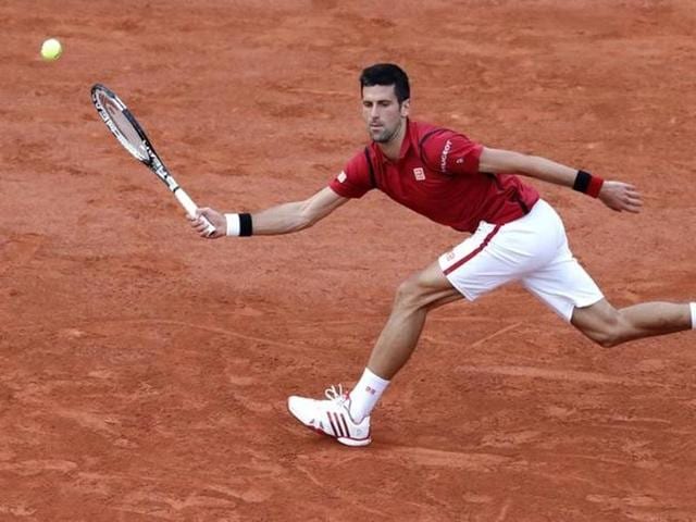 Djokovic returns a shot against Aljaz Bedene. (Reuters) Djokovic returns a shot against Aljaz Bedene. (Reuters)